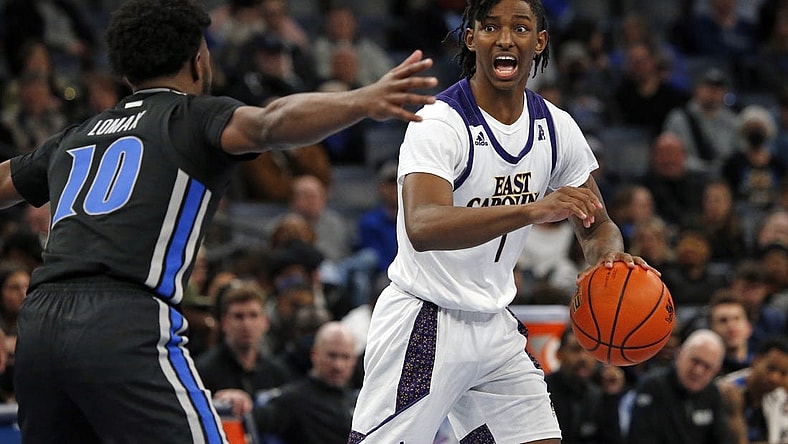 Jan 27, 2022; Memphis, Tennessee, USA; East Carolina Pirates guard Javon Small (1) dribbles as Memphis Tigers guard Alex Lomax (10) defends during the second half at FedExForum. Mandatory Credit: Petre Thomas-USA TODAY Sports