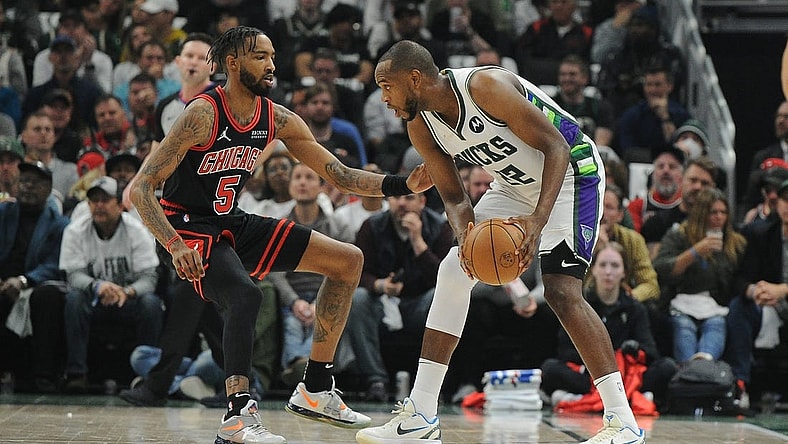 Apr 20, 2022; Milwaukee, Wisconsin, USA; Chicago Bulls forward Derrick Jones Jr. (5) defends Milwaukee Bucks forward Khris Middleton (22) in the first half during game two of the first round for the 2022 NBA playoffs at Fiserv Forum. Mandatory Credit: Michael McLoone-USA TODAY Sports