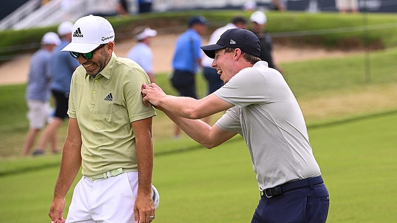 May 20, 2022; Tulsa, OK, USA;  Matthew Fitzpatrick and  Sergio Garcia walk down the first fairway during the second round of the PGA Championship golf tournament at Southern Hills Country Club. Mandatory Credit: Orlando Ramirez-USA TODAY Sports