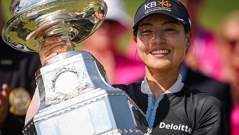Jun 26, 2022; Bethesda, Maryland, USA; In Gee Chun holds the trophy after wining the KPMG Women's PGA Championship golf tournament at Congressional Country Club. Mandatory Credit: Scott Taetsch-USA TODAY Sports