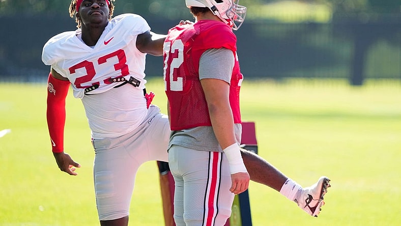 Aug 11, 2022; Columbus, OH, USA;  Ohio State Buckeyes defensive end Omari Abor (23) stretches with offensive lineman Avery Henry (72) during football camp at the Woody Hayes Athletic Center. Mandatory Credit: Adam Cairns-The Columbus Dispatch

Ohio State Football Camp