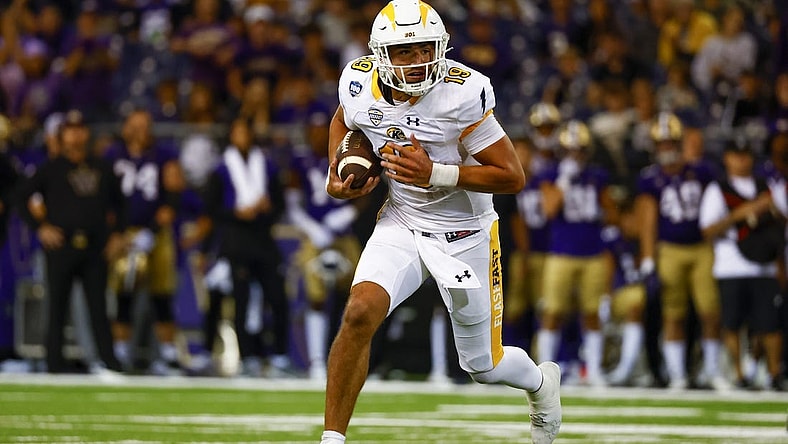 Sep 3, 2022; Seattle, Washington, USA; Kent State Golden Flashes quarterback Collin Schlee (19) rushes against the Washington Huskies during the second quarter at Alaska Airlines Field at Husky Stadium. Mandatory Credit: Joe Nicholson-USA TODAY Sports