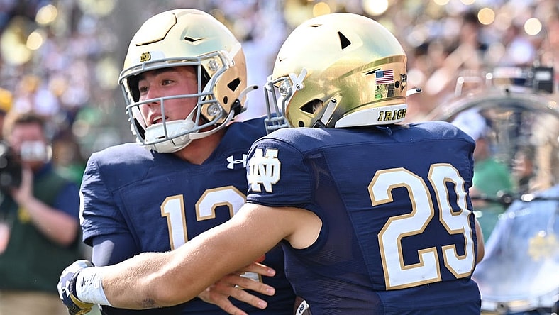 Sep 10, 2022; South Bend, Indiana, USA; Notre Dame Fighting Irish quarterback Tyler Buchner (12) celebrates with wide receiver Matt Salerno (29) after running for a two point conversation in the fourth quarter against the Marshall Thundering Herd at Notre Dame Stadium. Mandatory Credit: Matt Cashore-USA TODAY Sports