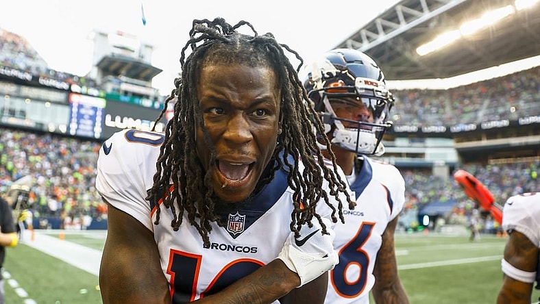 Sep 12, 2022; Seattle, Washington, USA; Denver Broncos wide receiver Jerry Jeudy (10) celebrates on the sideline after catching a touchdown pass against the Seattle Seahawks during the second quarter at Lumen Field. Mandatory Credit: Joe Nicholson-USA TODAY Sports