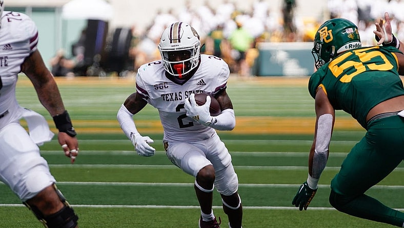 Sep 17, 2022; Waco, Texas, USA;  Texas State Bobcats wide receiver Ashtyn Hawkins (2) runs against Baylor Bears linebacker Garmon Randolph (55) during the first half at McLane Stadium. Mandatory Credit: Chris Jones-USA TODAY Sports