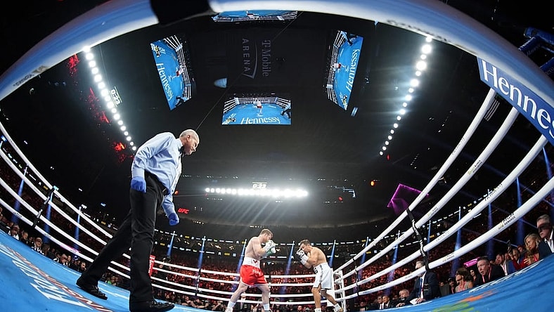 Sep 17, 2022; Las Vegas, Nevada, USA; Canelo Alvarez (red trunks) and Gennadiy Golovkin (white trunks) box during a middleweight championship bout at T-Mobile Arena. Mandatory Credit: Joe Camporeale-USA TODAY Sports