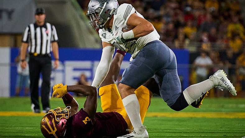 Sep 17, 2022; Tempe, Arizona, USA; Eastern Michigan Eagles running back Samson Evans (22) pushes Arizona State Sun Devils defensive back D.J. Taylor (3) down at Sun Devil Stadium in Tempe.

Football Asu Fb