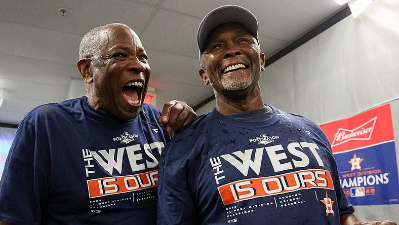 Sep 19, 2022; St. Petersburg, Florida, USA;  Houston Astros manager Dusty Baker Jr. (12) and third base coach Gary Pettis (8) celebrate winning the American League West at Tropicana Field. Mandatory Credit: Nathan Ray Seebeck-USA TODAY Sports