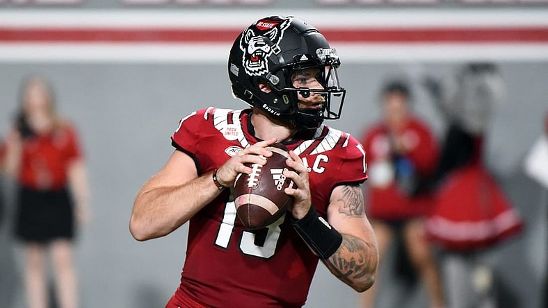 Sep 24, 2022; Raleigh, North Carolina, USA; North Carolina State Wolfpack quarterback Devin Leary (13) looks to throw during the first half against the Connecticut Huskies at Carter-Finley Stadium. Mandatory Credit: Rob Kinnan-USA TODAY Sports