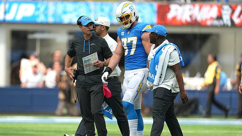 Sep 25, 2022; Inglewood, California, USA; Los Angeles Chargers linebacker Joey Bosa (97) walks off the field with Brandon Staley after suffering an injury against the Jacksonville Jaguars in the first half at SoFi Stadium. Mandatory Credit: Kirby Lee-USA TODAY Sports