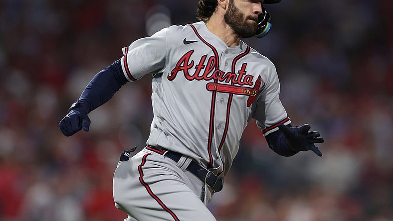 Oct 14, 2022; Philadelphia, Pennsylvania, USA; Atlanta Braves shortstop Dansby Swanson hits a double against the Philadelphia Phillies during the 6th inning in game three of the NLDS for the 2022 MLB Playoffs at Citizens Bank Park. Mandatory Credit: Bill Streicher-USA TODAY Sports