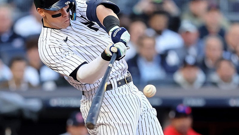 Oct 18, 2022; Bronx, New York, USA; New York Yankees right fielder Aaron Judge (99) hits a home run against the Cleveland Guardians during the second inning in game five of the ALDS for the 2022 MLB Playoffs at Yankee Stadium. Mandatory Credit: Brad Penner-USA TODAY Sports