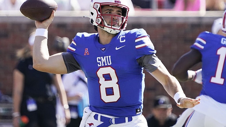 Oct 22, 2022; Dallas, Texas, USA; Southern Methodist Mustangs quarterback Tanner Mordecai (8) throws downfield during the first half against the Cincinnati Bearcats at Gerald J. Ford Stadium. Mandatory Credit: Raymond Carlin III-USA TODAY Sports