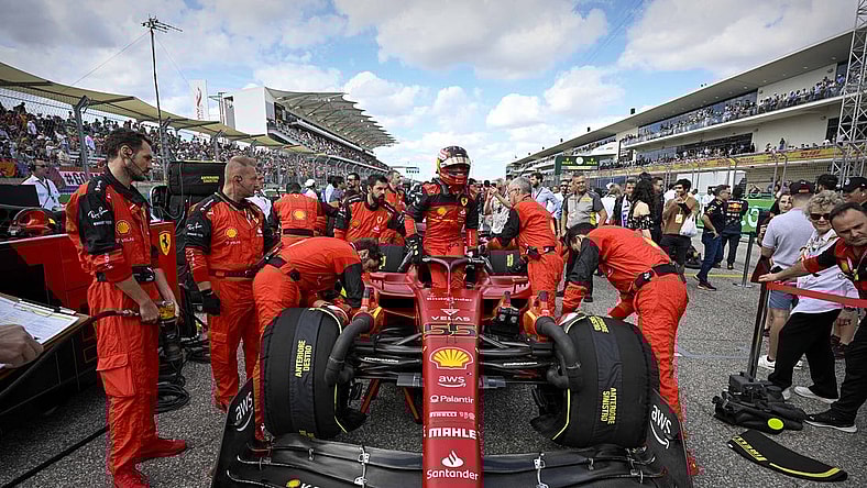 Oct 23, 2022; Austin, Texas, USA; Scuderia Ferrari driver Carlos Sainz (55) of Team Spain exits his car before the start of the U.S. Grand Prix F1 race at Circuit of the Americas. Mandatory Credit: Jerome Miron-USA TODAY Sports