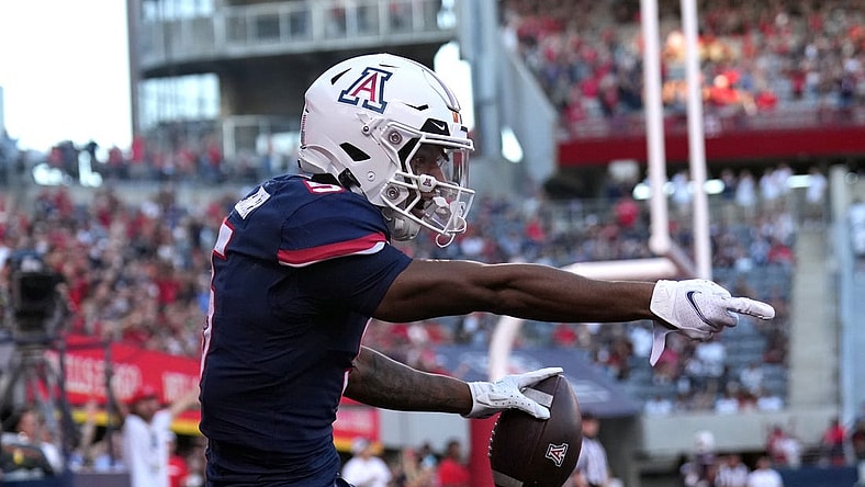 Oct 29, 2022; Tucson, Arizona, USA; Arizona Wildcats wide receiver Dorian Singer (5) reacts after being ruled out of bounds against the USC Trojans during the first half at Arizona Stadium. Mandatory Credit: Joe Camporeale-USA TODAY Sports