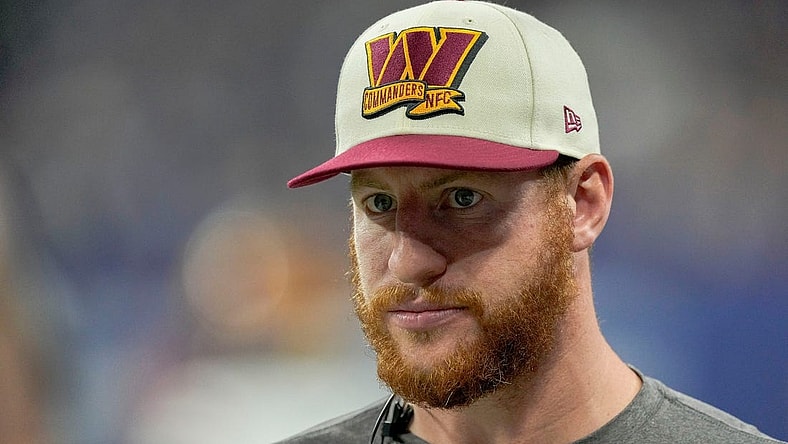 Washington Commanders quarterback Carson Wentz (11) walks along the sideline Sunday, Oct. 30, 2022, during a game against the Indianapolis Colts at Indianapolis Colts at Lucas Oil Stadium in Indianapolis.