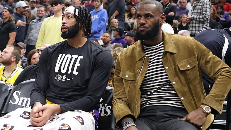 Nov 7, 2022; Salt Lake City, Utah, USA; Los Angeles Lakers forward Anthony Davis (left) and forward LeBron James (right) watch from the bench as their team play the Utah Jazz in the second half at Vivint Arena. Mandatory Credit: Rob Gray-USA TODAY Sports