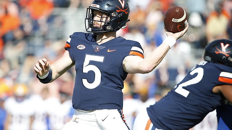 Nov 12, 2022; Charlottesville, Virginia, USA; Virginia Cavaliers quarterback Brennan Armstrong (5) throws the ball against the Pittsburgh Panthers during the first half at Scott Stadium. Mandatory Credit: Amber Searls-USA TODAY Sports