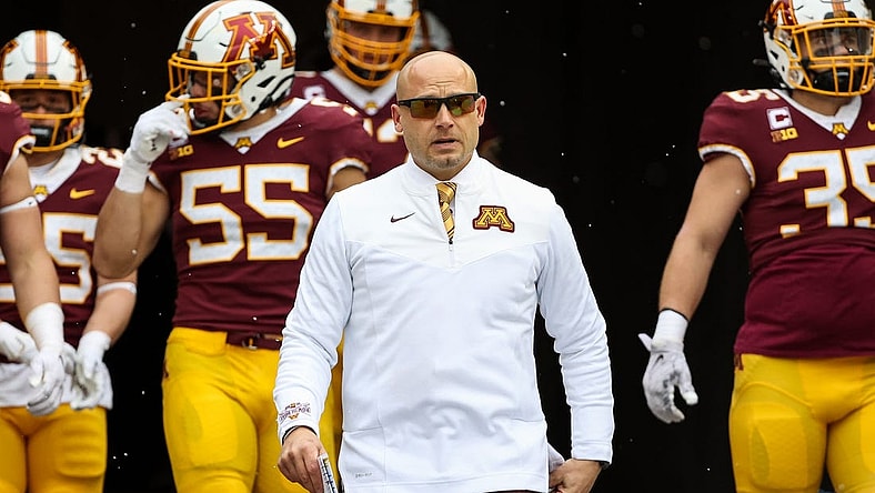 Nov 12, 2022; Minneapolis, Minnesota, USA; Minnesota Golden Gophers head coach P.J. Fleck leads his team out onto the field before the game against the Northwestern Wildcats at Huntington Bank Stadium. Mandatory Credit: Matt Krohn-USA TODAY Sports