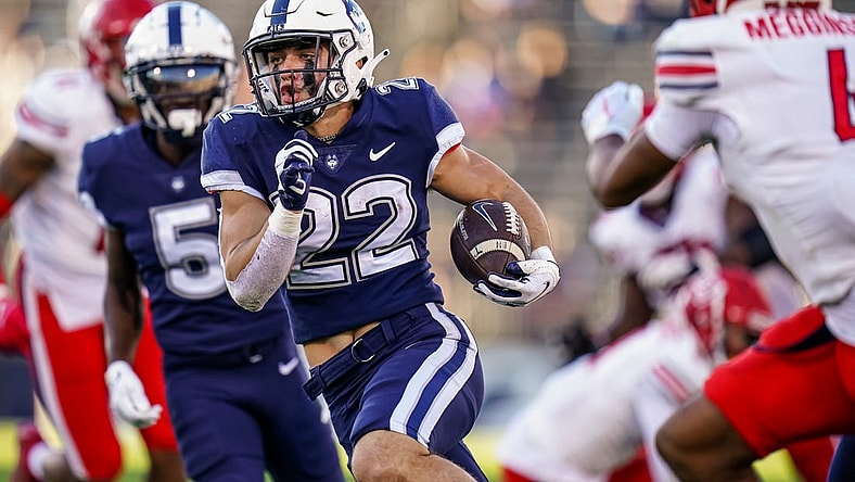 Nov 12, 2022; East Hartford, Connecticut, USA; Connecticut Huskies running back Victor Rosa (22) runs the ball for a touchdown against the Liberty Flames in the second half at Rentschler Field at Pratt & Whitney Stadium. Mandatory Credit: David Butler II-USA TODAY Sports