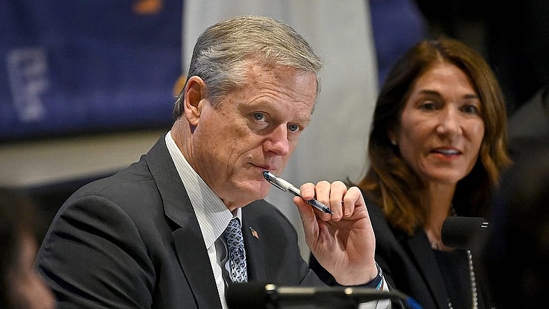Gov. Charlie Baker listens to Framingham High School students during a roundtable discussion on the state's Early College program at MassBay Community College in Framingham, Nov. 17, 2022.