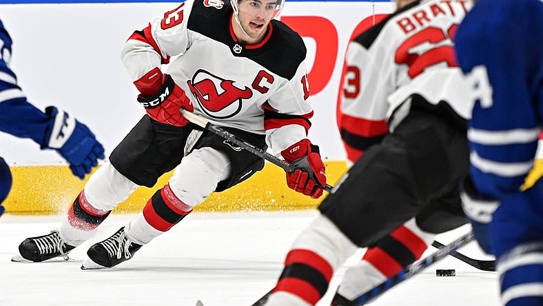 Nov 17, 2022; Toronto, Ontario, CAN; New Jersey Devils forward Nico Hischier (13) skates with the puck against the Toronto Maple Leaf in the third period at Scotiabank Arena. Mandatory Credit: Dan Hamilton-USA TODAY Sports