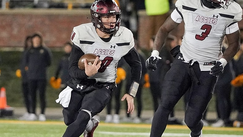 Nov 19, 2022; Columbia, Missouri, USA; New Mexico State Aggies quarterback Diego Pavia (10) runs the ball against the Missouri Tigers during the first half at Faurot Field at Memorial Stadium. Mandatory Credit: Denny Medley-USA TODAY Sports