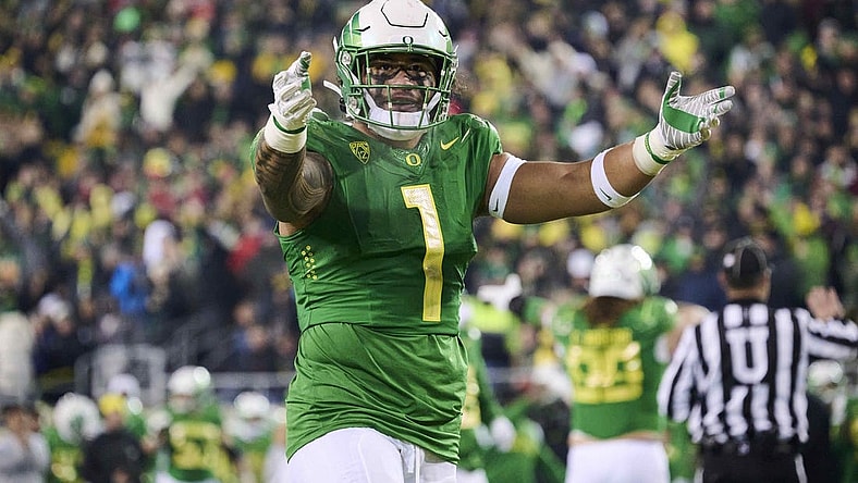 Nov 19, 2022; Eugene, Oregon, USA; Oregon Ducks linebacker Noah Sewell (1) encourages fans during the first half against the Utah Utes at Autzen Stadium. Mandatory Credit: Troy Wayrynen-USA TODAY Sports