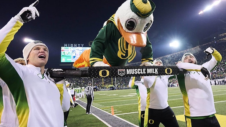 Nov 19, 2022; Eugene, Oregon, USA; Oregon Ducks mascot Puddles does push ups after an Oregon touchdown during the second half against the Utah Utes at Autzen Stadium. The Ducks won the game 20-17. Mandatory Credit: Troy Wayrynen-USA TODAY Sports