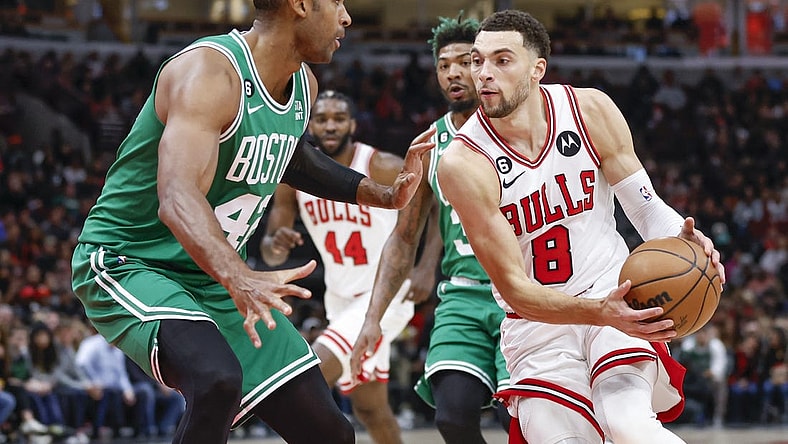 Nov 21, 2022; Chicago, Illinois, USA; Chicago Bulls guard Zach LaVine (8) moves to the basket against Boston Celtics center Al Horford (42) during the first half at United Center. Mandatory Credit: Kamil Krzaczynski-USA TODAY Sports
