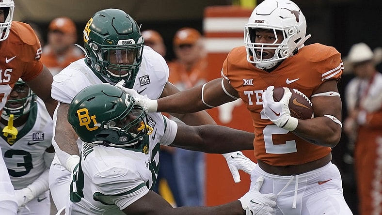 Nov 25, 2022; Austin, Texas, USA; Texas Longhorns running back Roschon Johnson (2) runs for yards during the first half against the Baylor Bears at Darrell K Royal-Texas Memorial Stadium. Mandatory Credit: Scott Wachter-USA TODAY Sports
