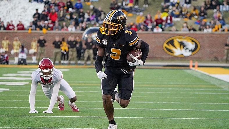 Nov 25, 2022; Columbia, Missouri, USA; Missouri Tigers wide receiver Dominic Lovett (7) runs in for a touchdown against Arkansas Razorbacks during the second half at Faurot Field at Memorial Stadium. Mandatory Credit: Denny Medley-USA TODAY Sports