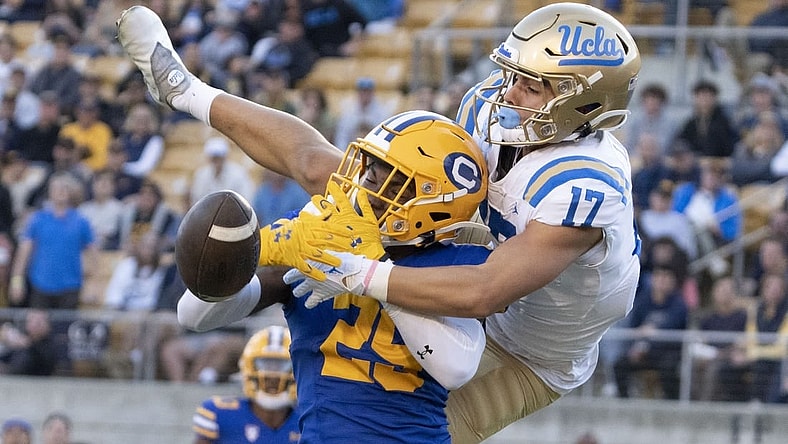 November 25, 2022; Berkeley, California, USA; UCLA Bruins wide receiver Logan Loya (17) and California Golden Bears cornerback Jeremiah Earby (29) go for the football during the third quarter at California Memorial Stadium. Mandatory Credit: Kyle Terada-USA TODAY Sports