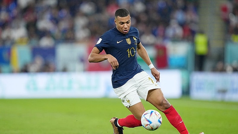 Nov 26, 2022; Doha, Qatar; France forward Kylian Mbappe (10) controls the ball against Denmark during the first half of a group stage match during the 2022 World Cup at Stadium 974. Mandatory Credit: Danielle Parhizkaran-USA TODAY Sports