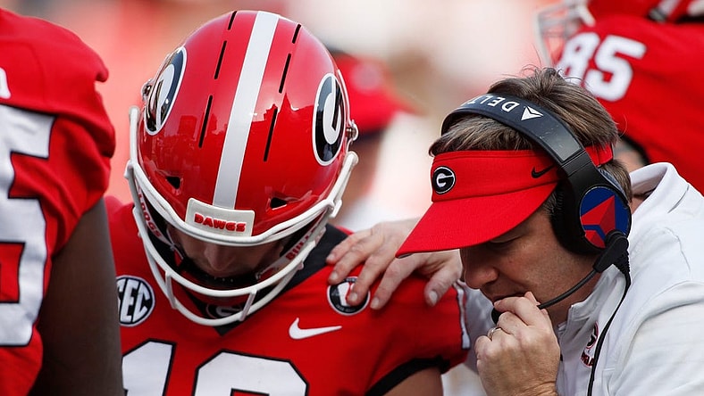 Georgia head coach Kirby Smart speaks with Georgia quarterback Stetson Bennett (13) in the huddle during the second half of an NCAA college football game between Georgia Tech and Georgia in Athens, Ga., on Saturday, Nov. 26, 2022. Georgia won 37-14.

News Joshua L Jones