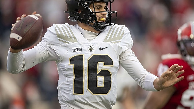 Nov 26, 2022; Bloomington, Indiana, USA;  Purdue Boilermakers quarterback Aidan O'Connell (16) looks to throw a quick pass during the second quarter against the Indiana Hoosiers at Memorial Stadium. Mandatory Credit: Marc Lebryk-USA TODAY Sports