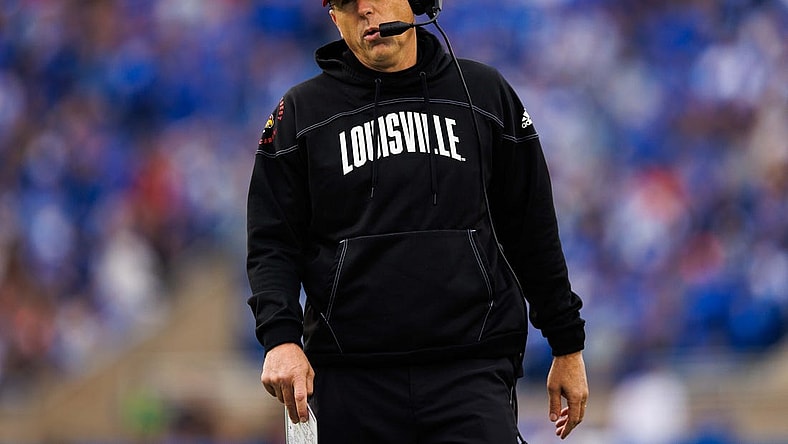 Nov 26, 2022; Lexington, Kentucky, USA; Louisville Cardinals head coach Scott Satterfield walks up the sideline during the first quarter against the Kentucky Wildcats at Kroger Field. Mandatory Credit: Jordan Prather-USA TODAY Sports