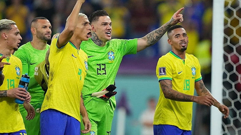 Nov 28, 2022; Doha, Qatar; Brazil forward Richarlison (9) goalkeeper Ederson (23) and forward Gabriel Jesus (18) celebrate the victory against Switzerland following the group stage match during the 2022 World Cup at Stadium 974. Mandatory Credit: Danielle Parhizkaran-USA TODAY Sports