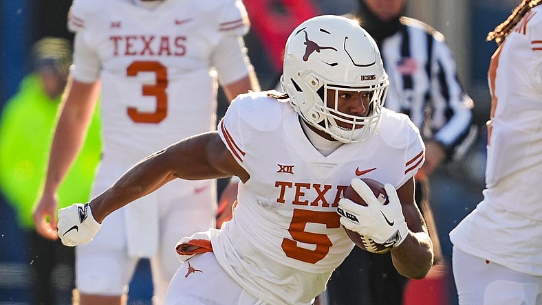 Nov 19, 2022; Lawrence, Kansas, USA; Texas Longhorns running back Bijan Robinson (5) runs the ball during the first half against the Kansas Jayhawks at David Booth Kansas Memorial Stadium. Mandatory Credit: Jay Biggerstaff-USA TODAY Sports