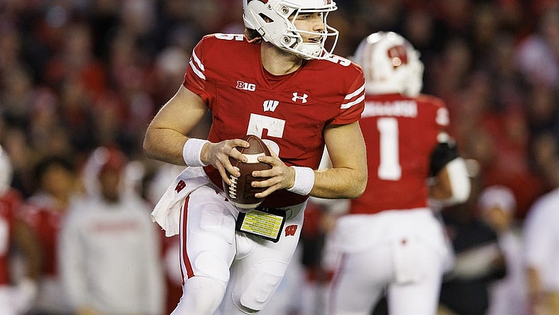 Nov 26, 2022; Madison, Wisconsin, USA;  Wisconsin Badgers quarterback Graham Mertz (5) during the game against the Minnesota Golden Gophers at Camp Randall Stadium. Mandatory Credit: Jeff Hanisch-USA TODAY Sports