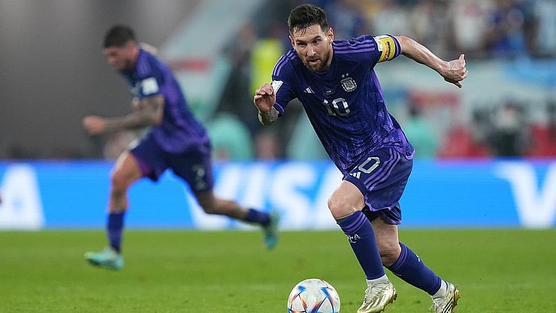 Nov 30, 2022; Doha, Qatar; Argentina forward Lionel Messi (10) moves the ball during the second half against Poland in a group stage match during the 2022 World Cup at Stadium 974. Mandatory Credit: Danielle Parhizkaran-USA TODAY Sports