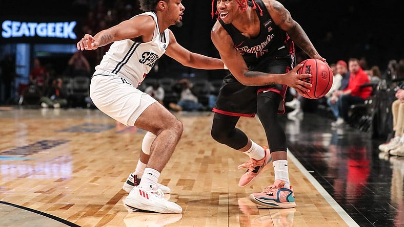 Nov 22, 2022; Brooklyn, New York, USA;  Temple Owls guard Khalif Battle (0) and Richmond Spiders guard Jason Nelson (1) at Barclays Center. Mandatory Credit: Wendell Cruz-USA TODAY Sports