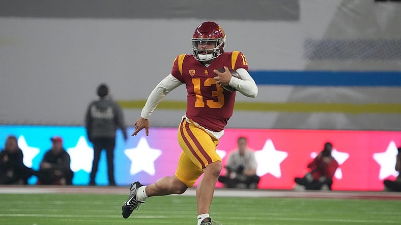 Dec 2, 2022; Las Vegas, NV, USA; Southern California Trojans quarterback Caleb Williams (13) carries the ball on a 59-yard run against the Utah Utes in the first half of the Pac-12 Championship at Allegiant Stadium. Mandatory Credit: Kirby Lee-USA TODAY Sports