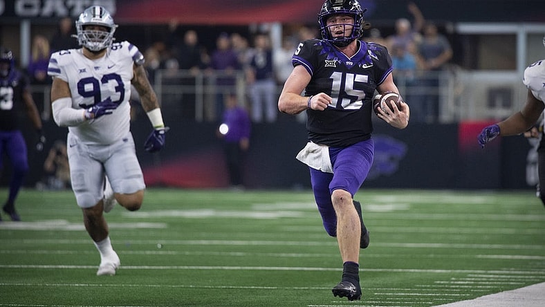 Dec 3, 2022; Arlington, TX, USA; TCU Horned Frogs quarterback Max Duggan (15) runs down the sidelines for a first down against the Kansas State Wildcats during the second half at AT&T Stadium. Mandatory Credit: Jerome Miron-USA TODAY Sports