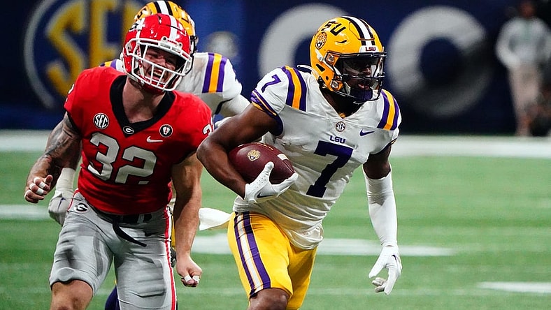 Dec 3, 2022; Atlanta, GA, USA; LSU Tigers wide receiver Kayshon Boutte (7) carries the ball for a receiving touchdown against the Georgia Bulldogs during the first quarter of the SEC Championship game at Mercedes-Benz Stadium. Mandatory Credit: John David Mercer-USA TODAY Sports