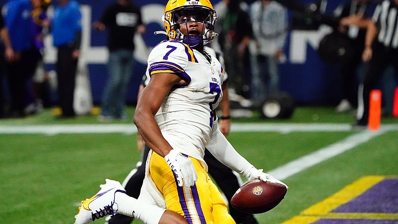 Dec 3, 2022; Atlanta, GA, USA; LSU Tigers wide receiver Kayshon Boutte (7) carries the ball for a receiving touchdown against the Georgia Bulldogs during the first quarter of the SEC Championship game at Mercedes-Benz Stadium. Mandatory Credit: John David Mercer-USA TODAY Sports