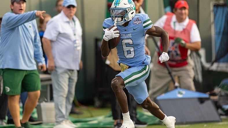 Dec 3, 2022; New Orleans, Louisiana, USA; Tulane Green Wave wide receiver Lawrence Keys III (6) catches a pass and runs in for a touchdown against the UCF Knights during the first half  at Yulman Stadium. Mandatory Credit: Stephen Lew-USA TODAY Sports