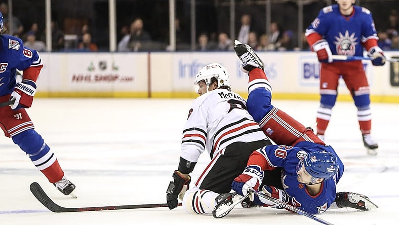 Dec 3, 2022; New York, New York, USA;  Chicago Blackhawks defenseman Jake McCabe (6) and New York Rangers left wing Chris Kreider (20) collide on the ice in the first period at Madison Square Garden. Mandatory Credit: Wendell Cruz-USA TODAY Sports