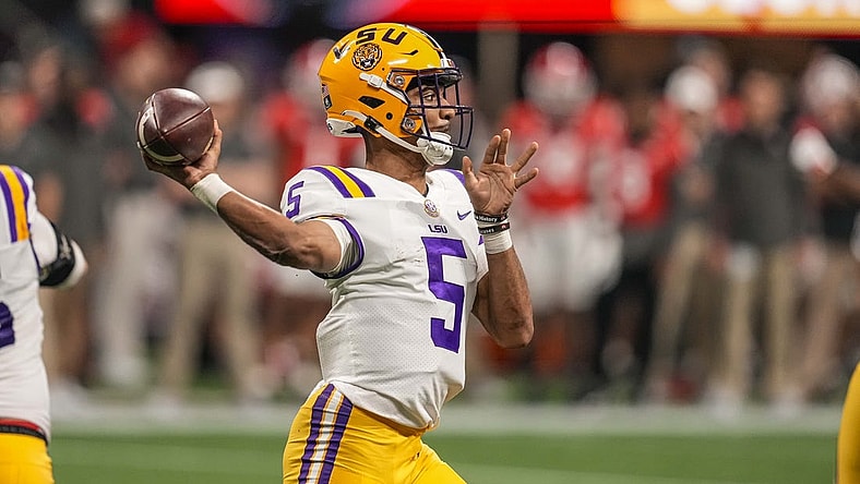 Dec 3, 2022; Atlanta, GA, USA; LSU Tigers quarterback Jayden Daniels (5) passes the ball against the Georgia Bulldogs at Mercedes-Benz Stadium. Mandatory Credit: Dale Zanine-USA TODAY Sports