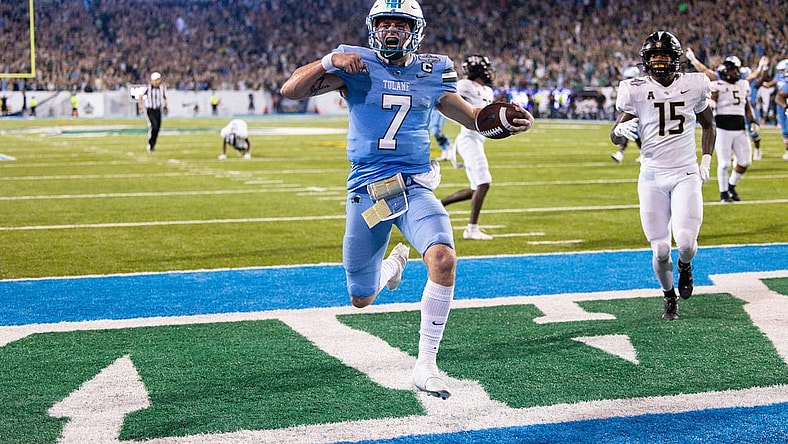 Dec 3, 2022; New Orleans, Louisiana, USA; Tulane Green Wave quarterback Michael Pratt (7) rushes in for a touchdown against the UCF Knights during the second half  at Yulman Stadium. Mandatory Credit: Stephen Lew-USA TODAY Sports